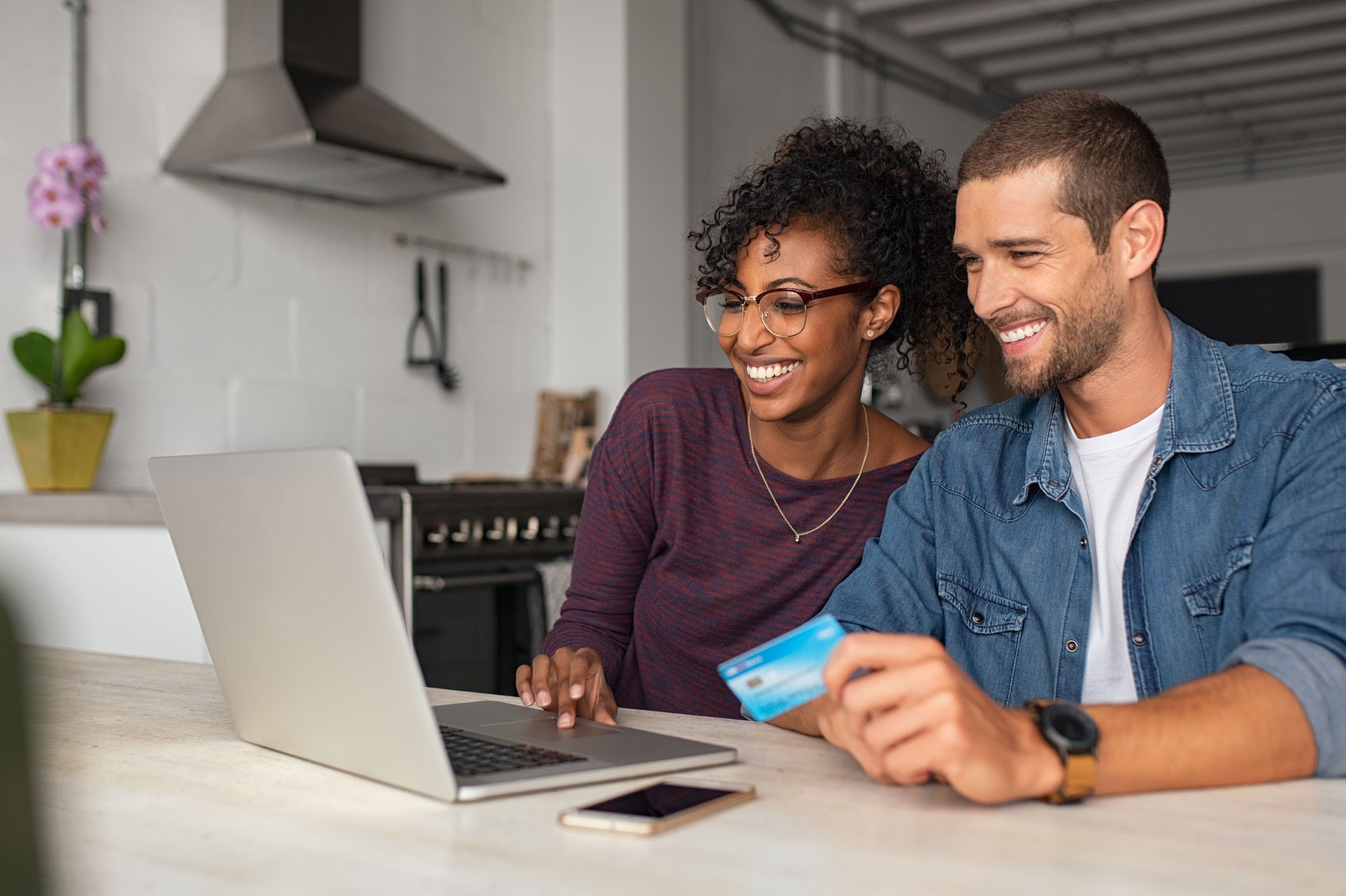 Happy multiethnic ouple making online payment